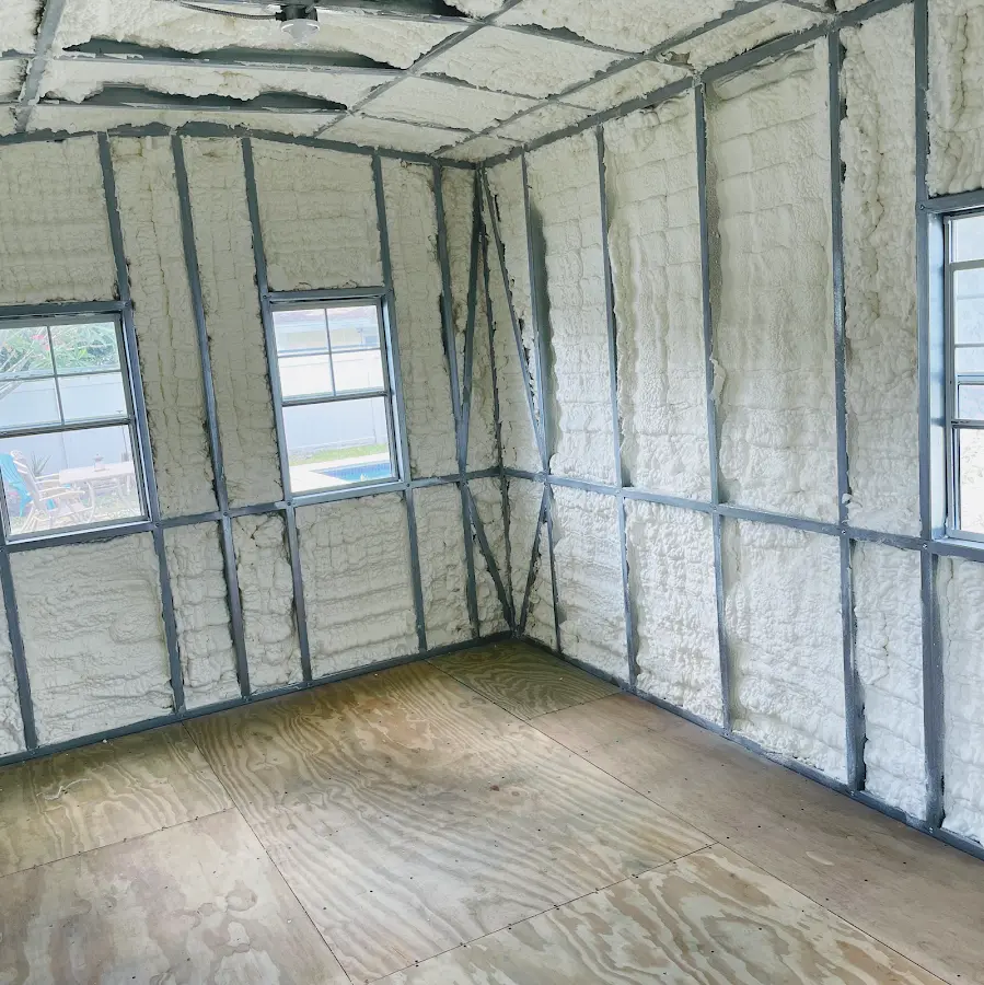 Closed-cell spray foam insulation applied to wall cavities in a residential project in Buenaventura Lakes